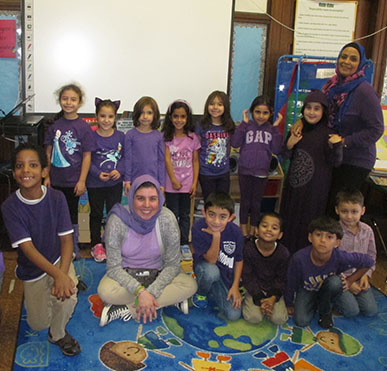 Students in classroom wearing purple