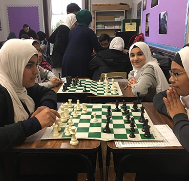 Students playing chess